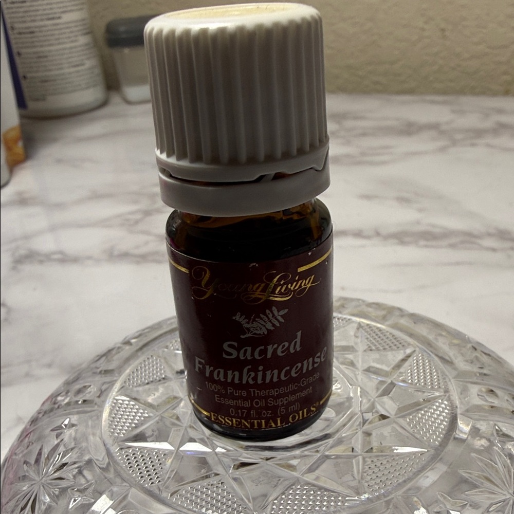 Young Living Sacred Frankincense Essential Oil - Brown and White